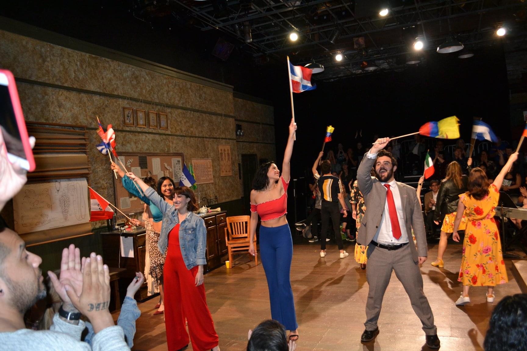 Mi Latinidad Performance - people waiving various flags 