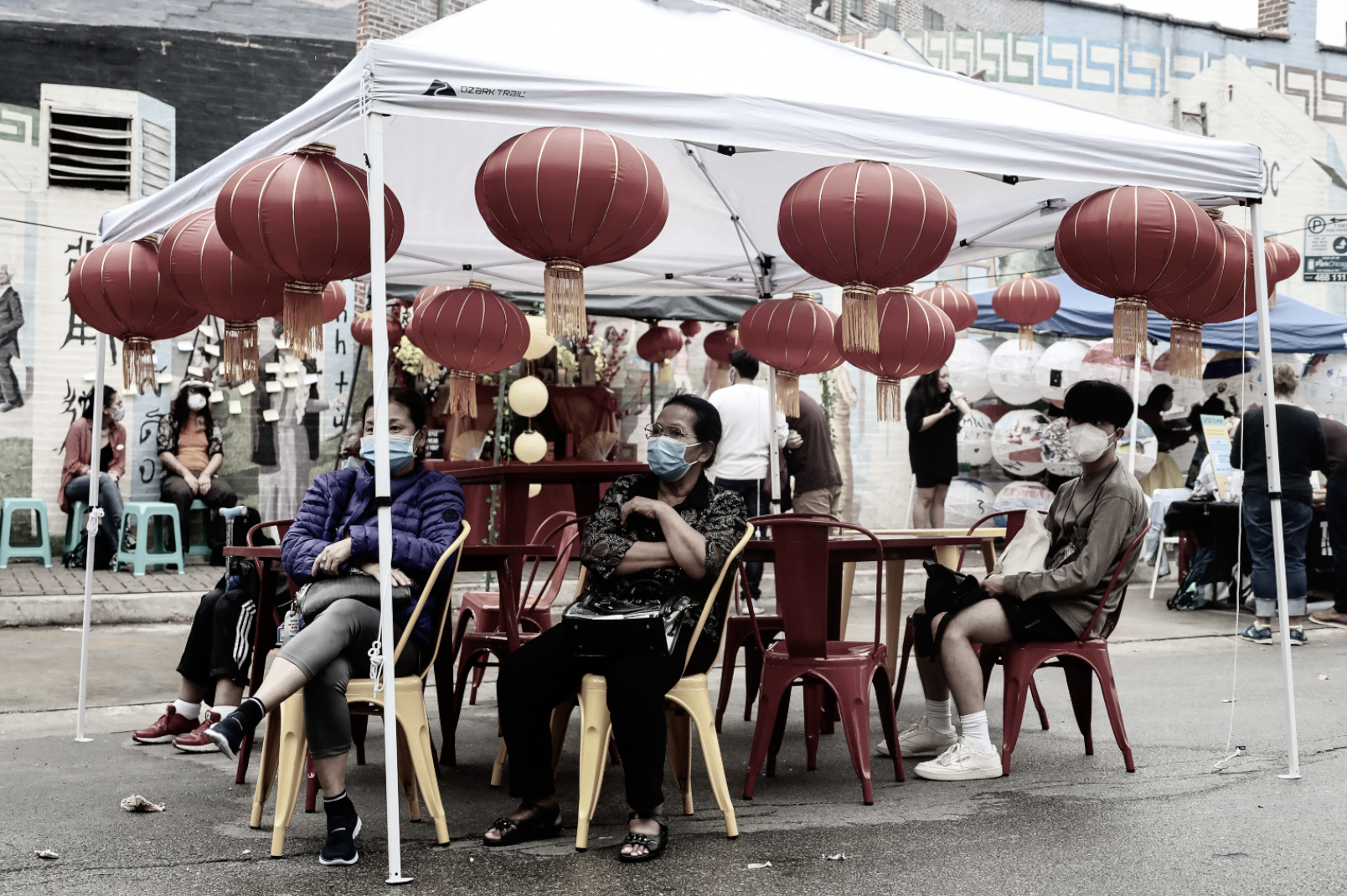 Haibayô Cares Event with people sitting at a table under a tent