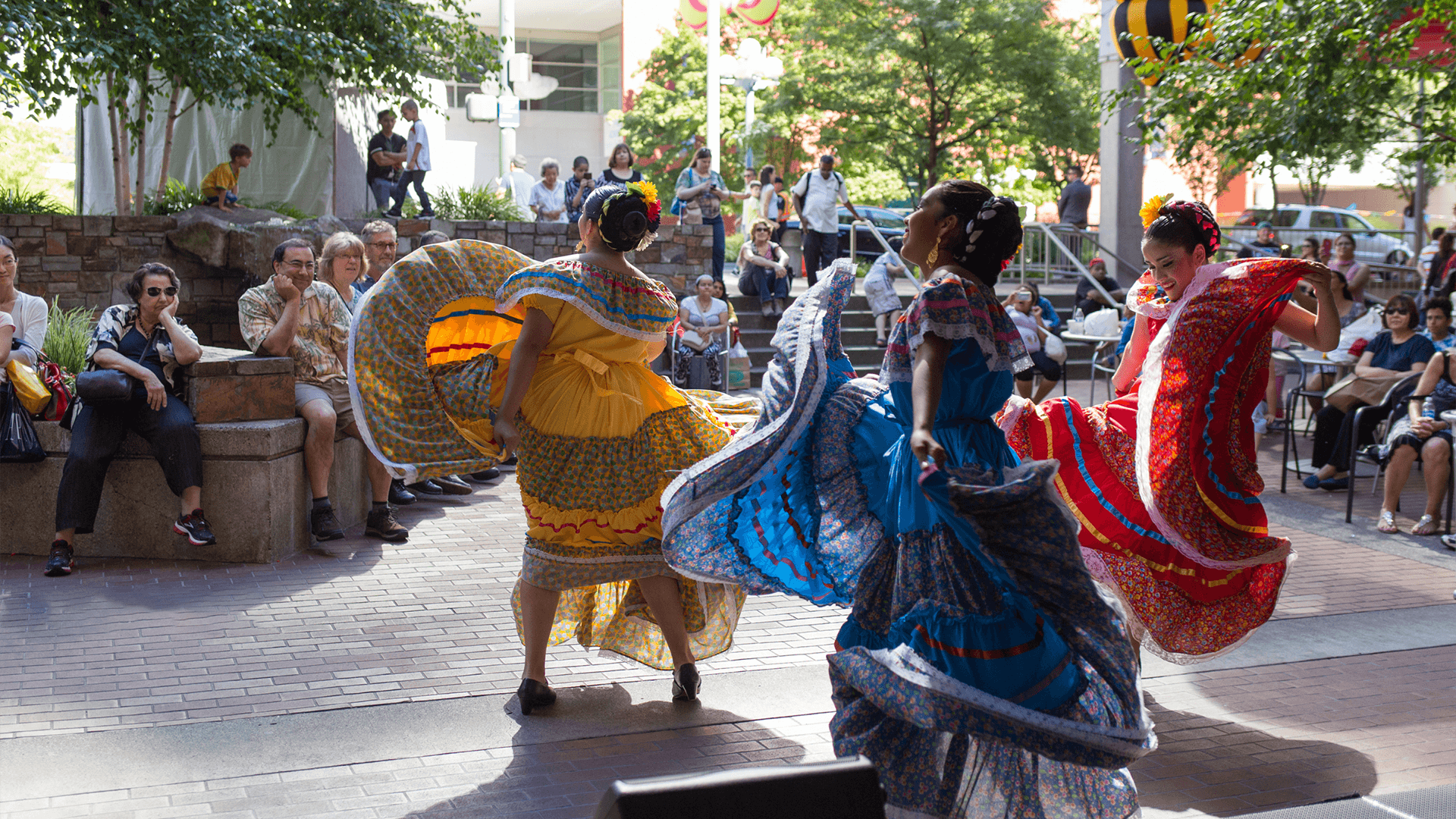 Traditional Latina dancers performing outdoors