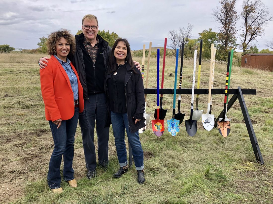From Left to Right: Lakota Funds Executive Director Tawney Brunsch, Artspace President Kelley Lindquist, and First Peoples Fund President Lori Pourier pose with artist-designed shovels at the Oglala Lakota Artspace Groundbreaking. September 2018.