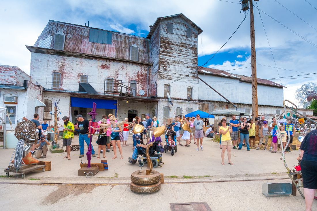 Attendees viewing artwork at Feed & Grain (2015) in Loveland, CO.