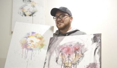 Kane Fletcher holds Art