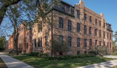 The exterior of Pullman Artspace Lofts against a sunny sky