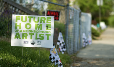 "Future home of an artist" neighborhood sign