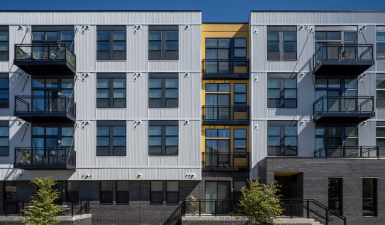 Image of the building it is three stories and yellow and blue*