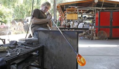 Artist Gavin Heath demonstrates the art of glass blowing