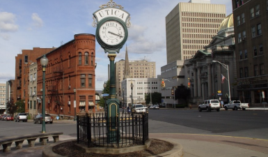 view of of the city of utica and famous clock